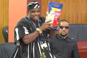 Watch as NDC MP 'storms' Parliament with rice, oil to compare prices